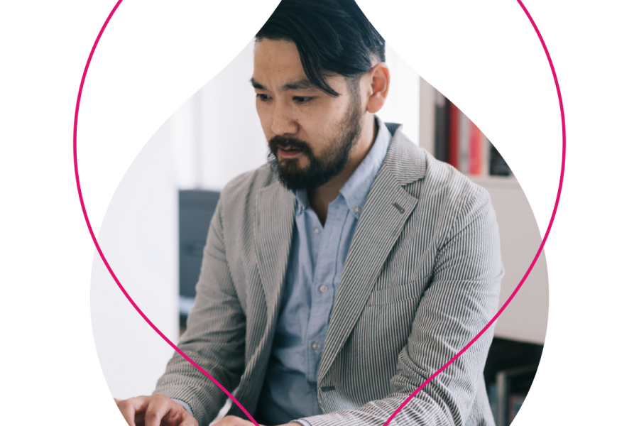 person on a computer masked by a droplet